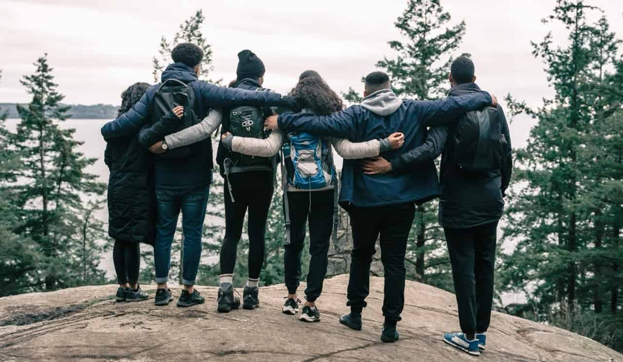 Group of hikers on a trail overlooking hills